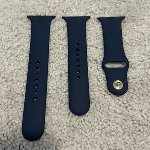 NWOT Apple Watch 42mm navy sports band with S/M and M/L band sizes.